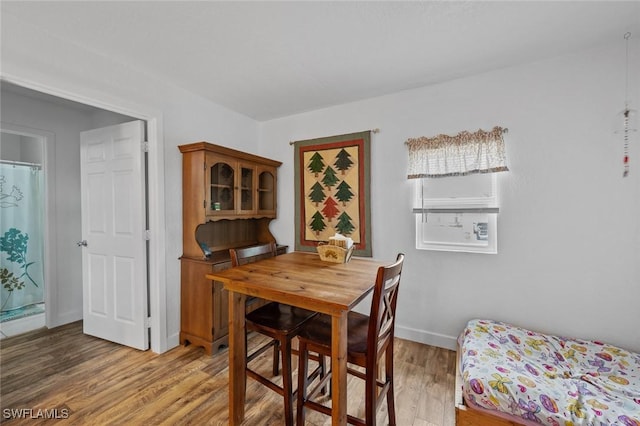 dining space featuring hardwood / wood-style flooring