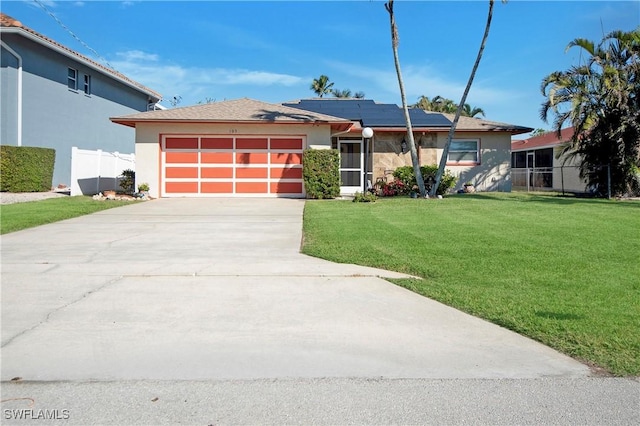 view of front of property with a garage and a front yard