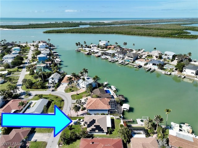 birds eye view of property featuring a water view