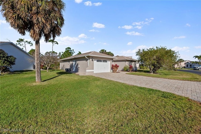 single story home with a garage and a front yard