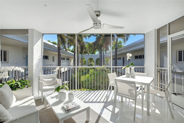 sunroom with a healthy amount of sunlight and ceiling fan