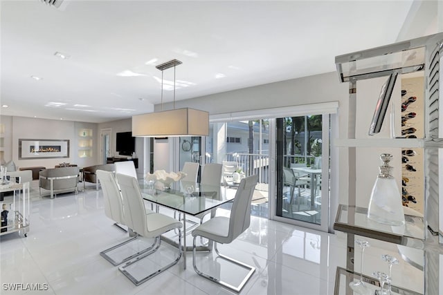 dining area featuring light tile patterned floors