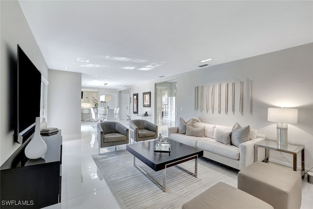 living room featuring light tile patterned flooring