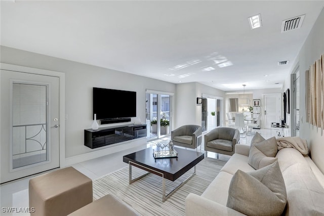 living room with light tile patterned floors