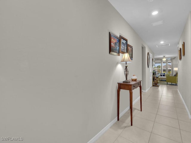 hallway with light tile patterned floors