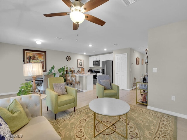 living room featuring ceiling fan and light tile patterned flooring