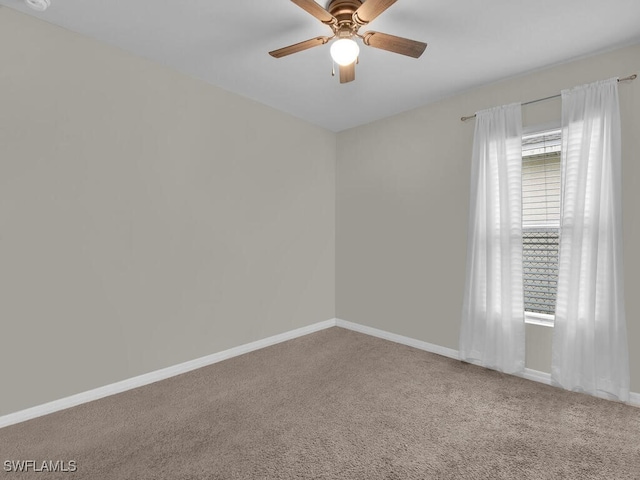 carpeted empty room with ceiling fan