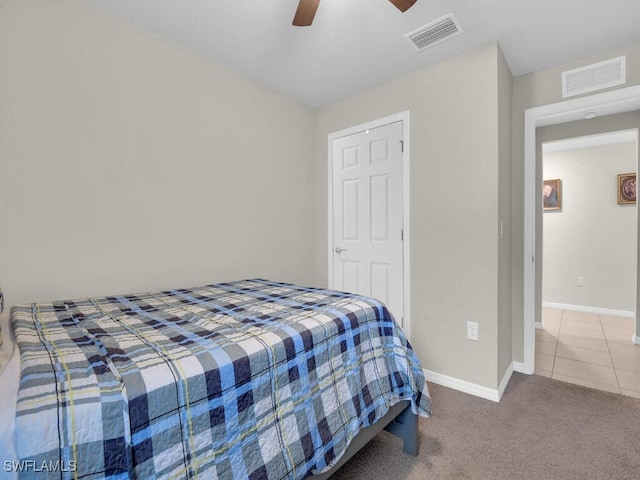 carpeted bedroom featuring ceiling fan