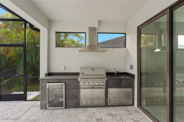 view of patio / terrace featuring area for grilling and sink