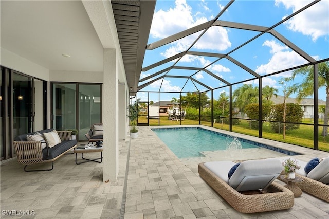 view of pool featuring a patio area, a lanai, and pool water feature