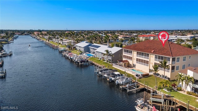 birds eye view of property featuring a water view