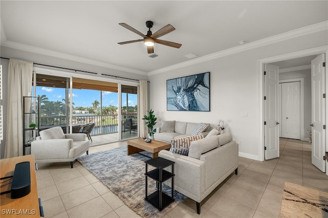 living room with light tile patterned floors, ornamental molding, ceiling fan, and a water view