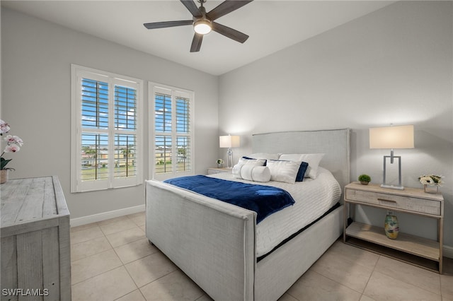 tiled bedroom with ceiling fan