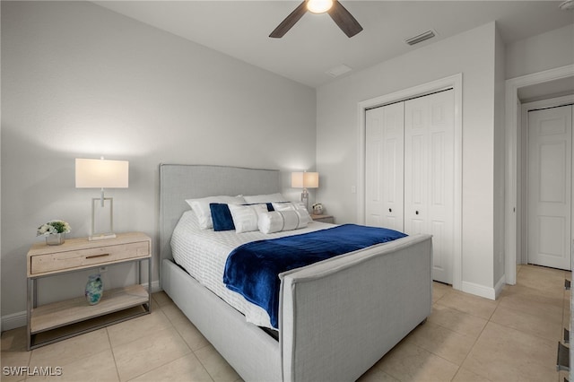 tiled bedroom with a closet and ceiling fan