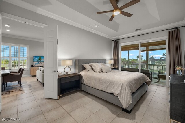 tiled bedroom featuring a tray ceiling, crown molding, access to outside, and ceiling fan