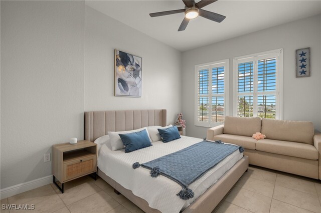 tiled bedroom with ceiling fan