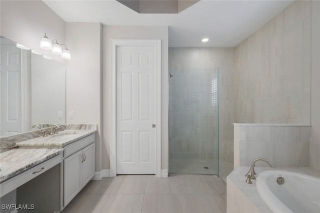 bathroom with vanity, tile patterned floors, and separate shower and tub