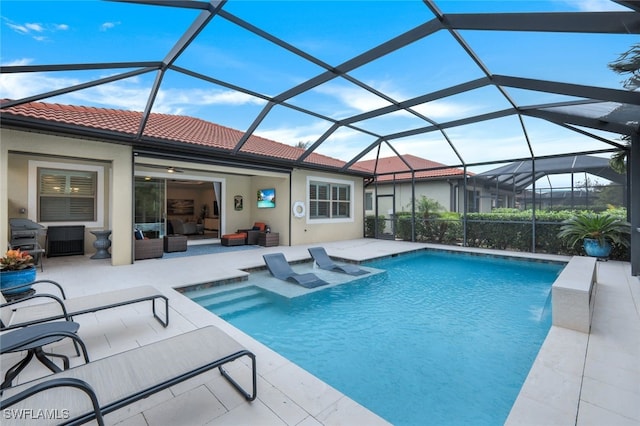 view of swimming pool with an outdoor hangout area, a lanai, and a patio area