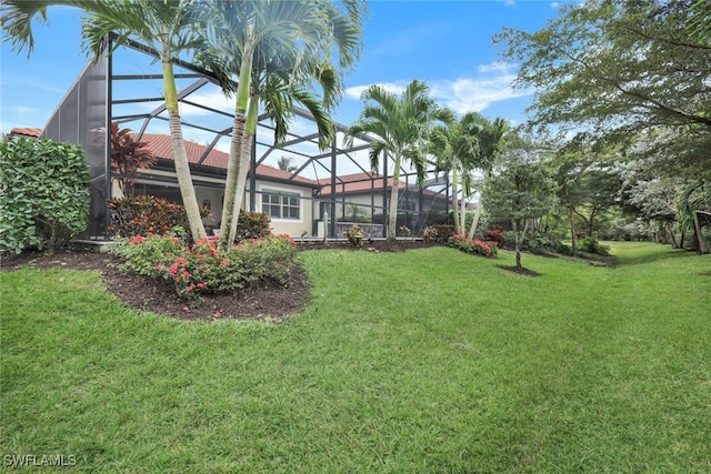 view of yard featuring a lanai