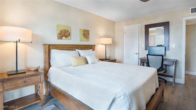 bedroom with wood-type flooring