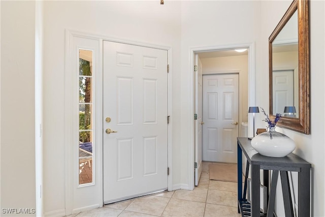 foyer featuring light tile patterned floors