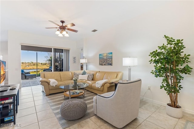 tiled living room with ceiling fan