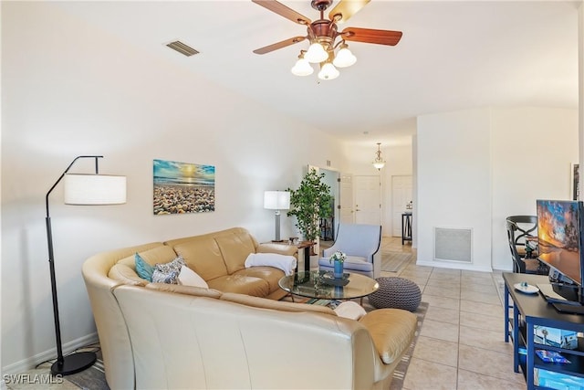 living room with ceiling fan and light tile patterned floors