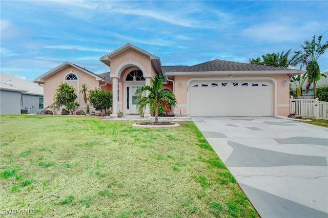 ranch-style house with a front yard and a garage