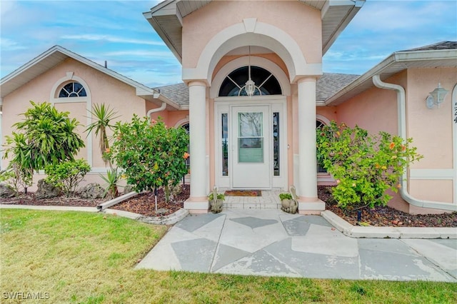 entrance to property with a yard