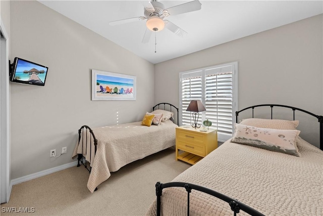 carpeted bedroom with ceiling fan and lofted ceiling