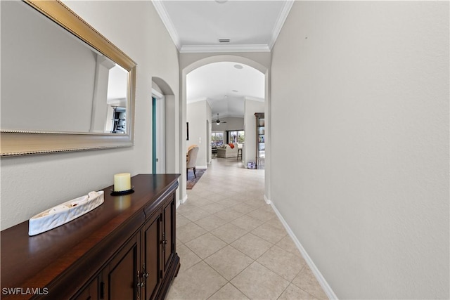 hallway featuring crown molding and light tile patterned flooring