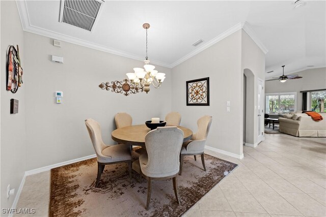 dining room featuring light tile patterned floors, ceiling fan with notable chandelier, and ornamental molding