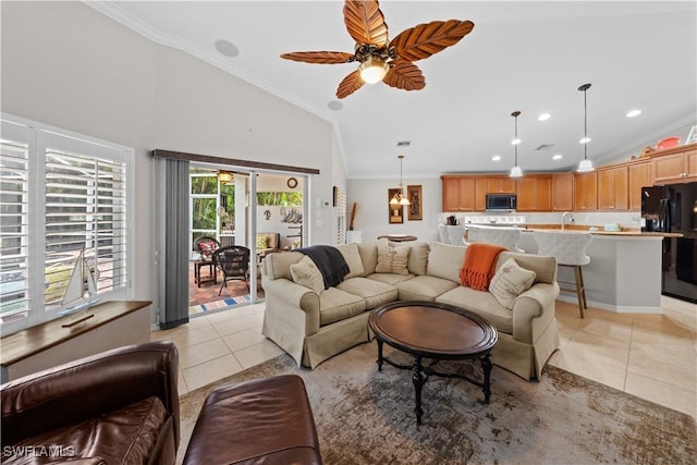 tiled living room with ceiling fan, high vaulted ceiling, and ornamental molding