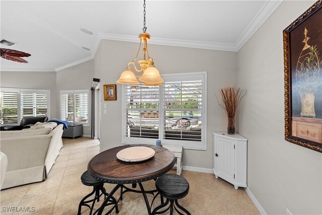 tiled dining room with vaulted ceiling, a notable chandelier, and crown molding