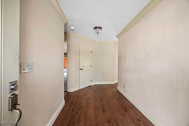 hall featuring ornamental molding and dark wood-type flooring