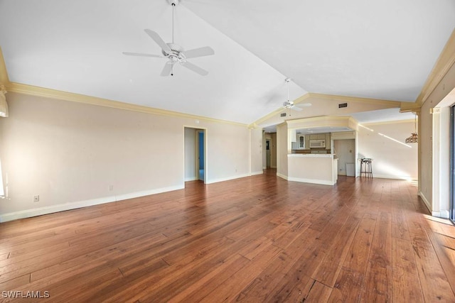 unfurnished living room with crown molding, ceiling fan, wood-type flooring, and vaulted ceiling