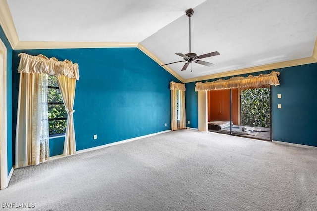 unfurnished living room featuring ceiling fan, ornamental molding, lofted ceiling, and carpet floors