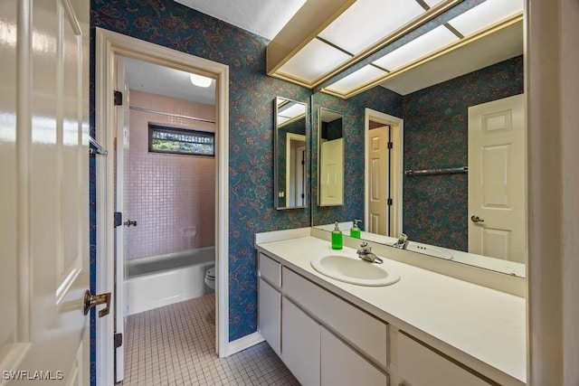 bathroom featuring vanity, toilet, and tile patterned flooring