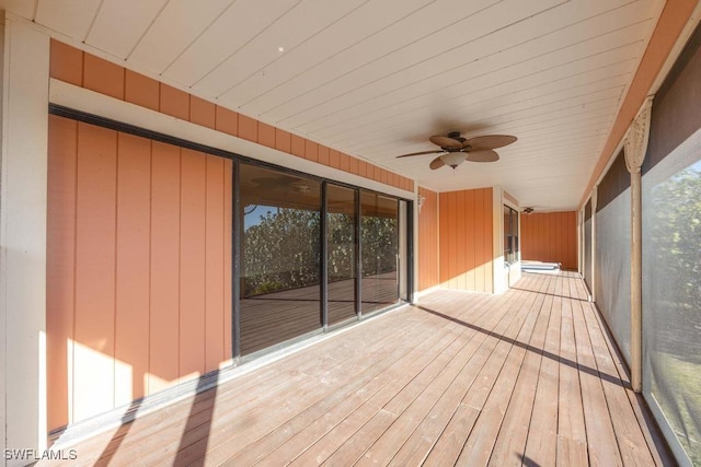 wooden deck with ceiling fan