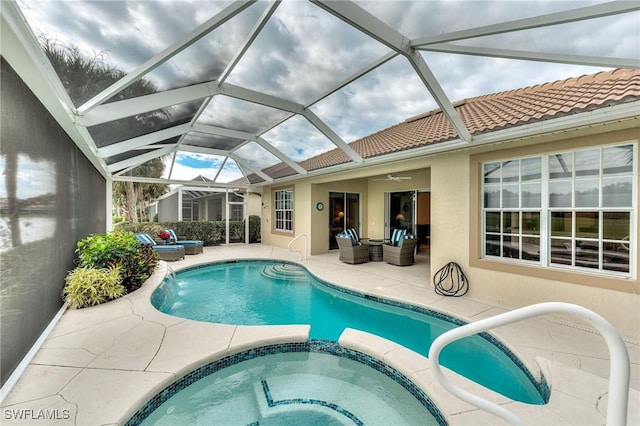 view of swimming pool with an outdoor living space, ceiling fan, an in ground hot tub, and a patio