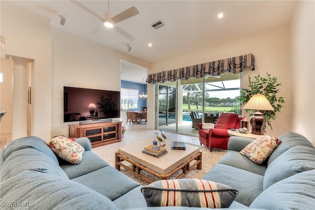 living room with ceiling fan and light tile patterned floors