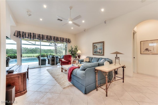 living room with ceiling fan and light tile patterned floors