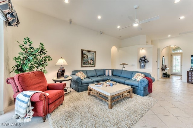 living room with ceiling fan and light tile patterned floors