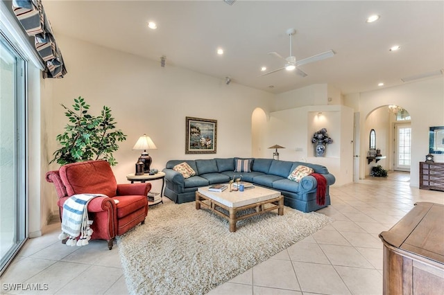 tiled living room with ceiling fan