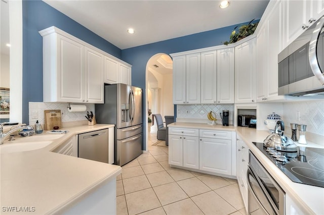 kitchen featuring sink, white cabinetry, and appliances with stainless steel finishes