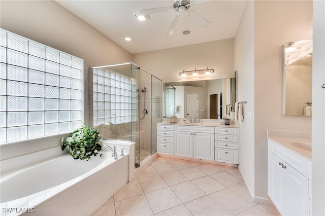 bathroom featuring ceiling fan, tile patterned floors, vanity, and shower with separate bathtub