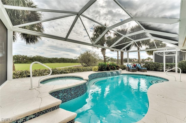 view of swimming pool with pool water feature, a patio, glass enclosure, and an in ground hot tub