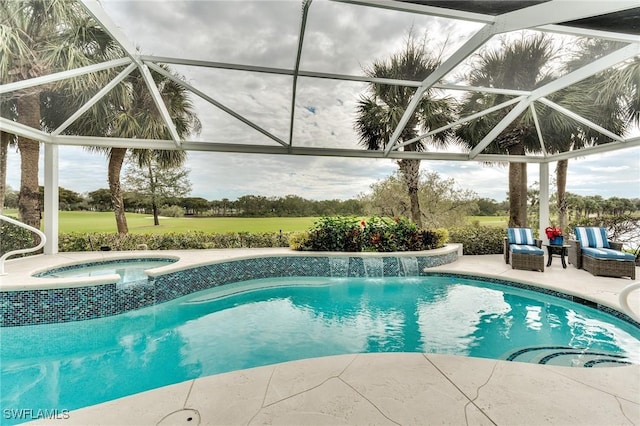 view of swimming pool featuring glass enclosure, a patio area, an in ground hot tub, and an outdoor hangout area