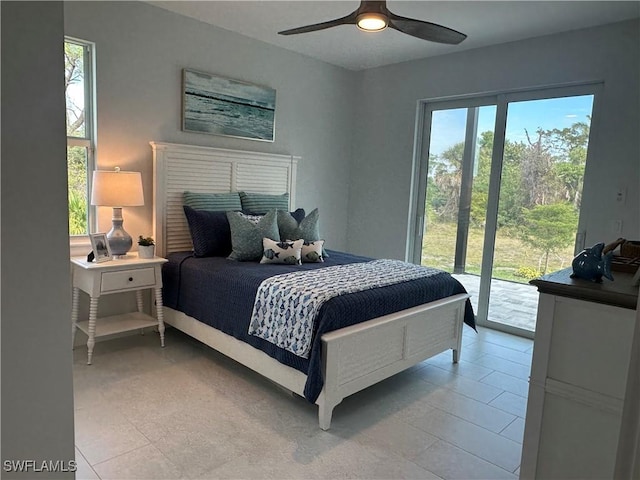 bedroom featuring ceiling fan, access to exterior, multiple windows, and light tile patterned floors