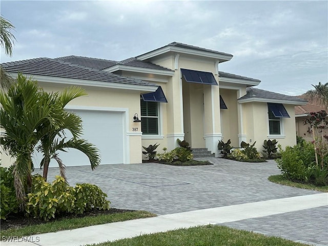 view of front of property with a garage